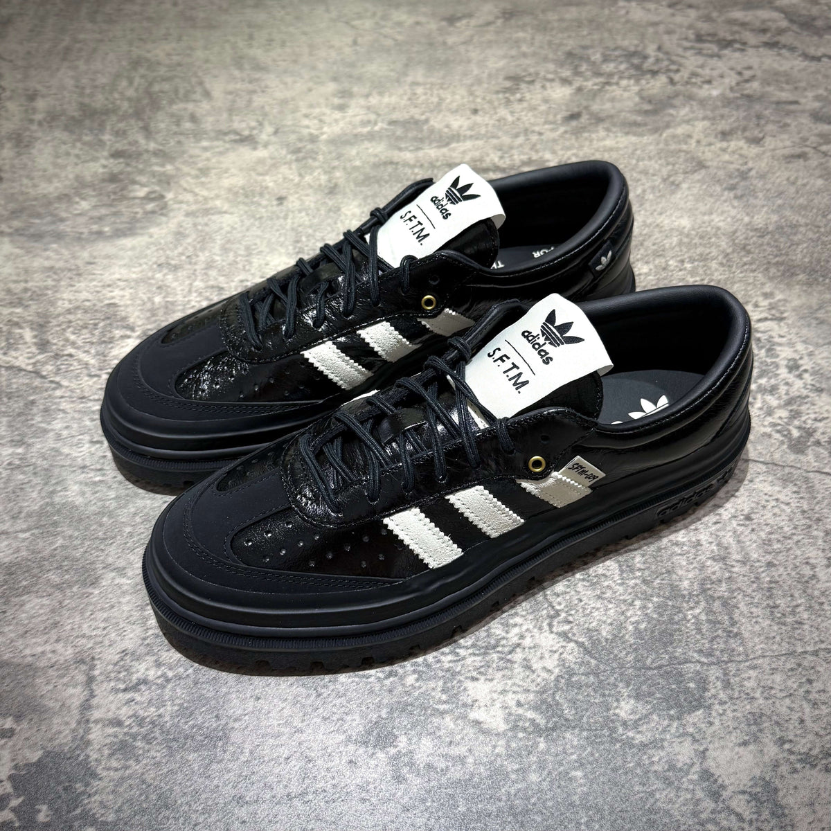adidas Samba LX Freizeit x Song For The Mute in black with silver stripes and logo, stylish sneaker design.
