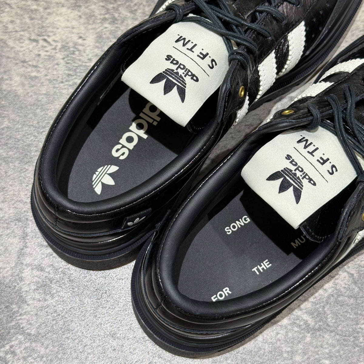 Top view of adidas Samba LX Freizeit x Song For The Mute shoes, featuring intricate design and branding details.
