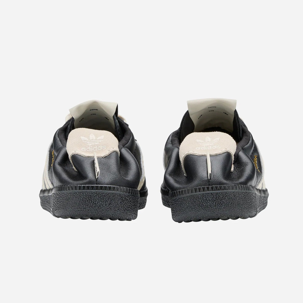 Rear view of adidas x Song for the Mute Samba HQ7600 shoes, showcasing their design and sleek silhouette.