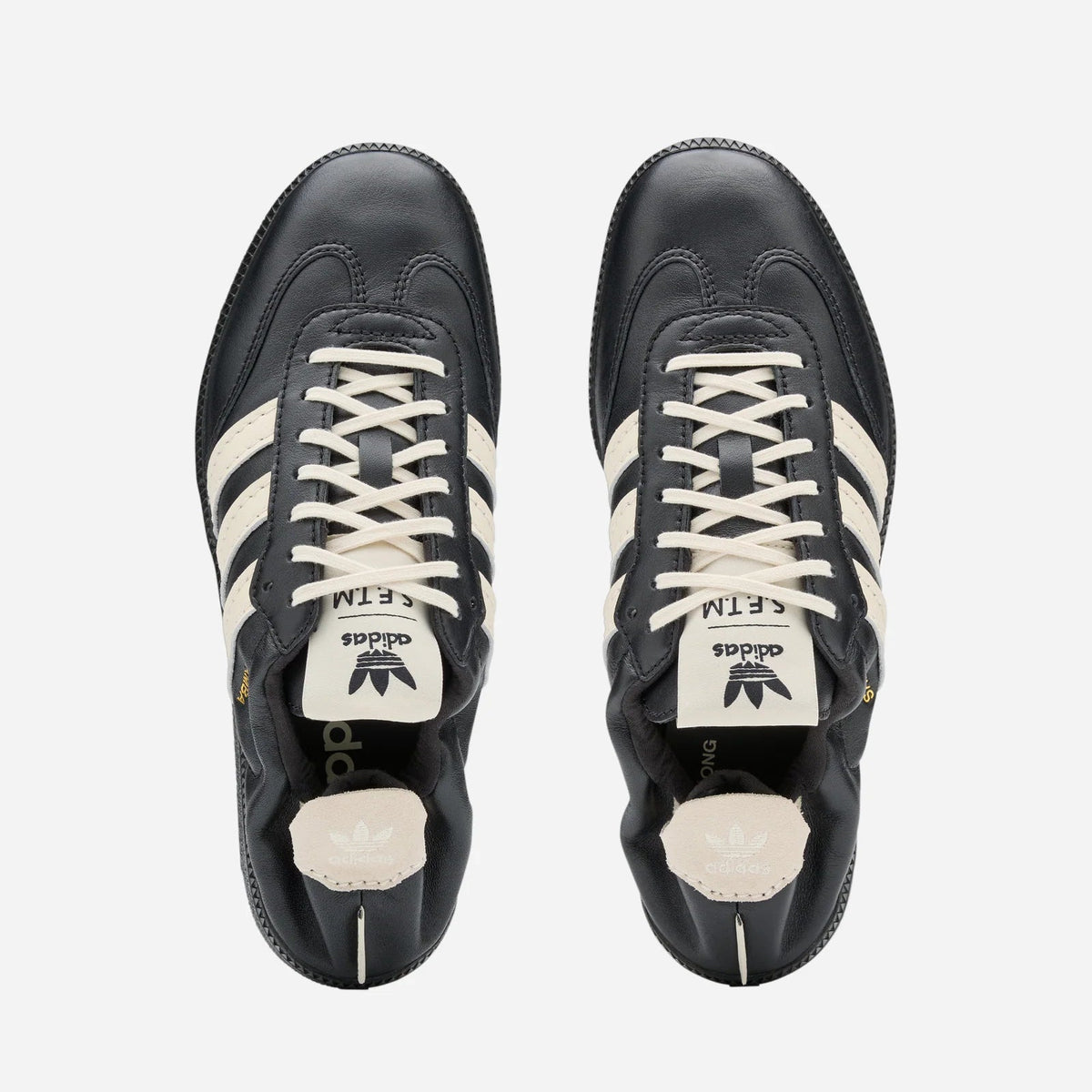 adidas x Song for the Mute Samba HQ7600 top view of black sneakers with white stripes
