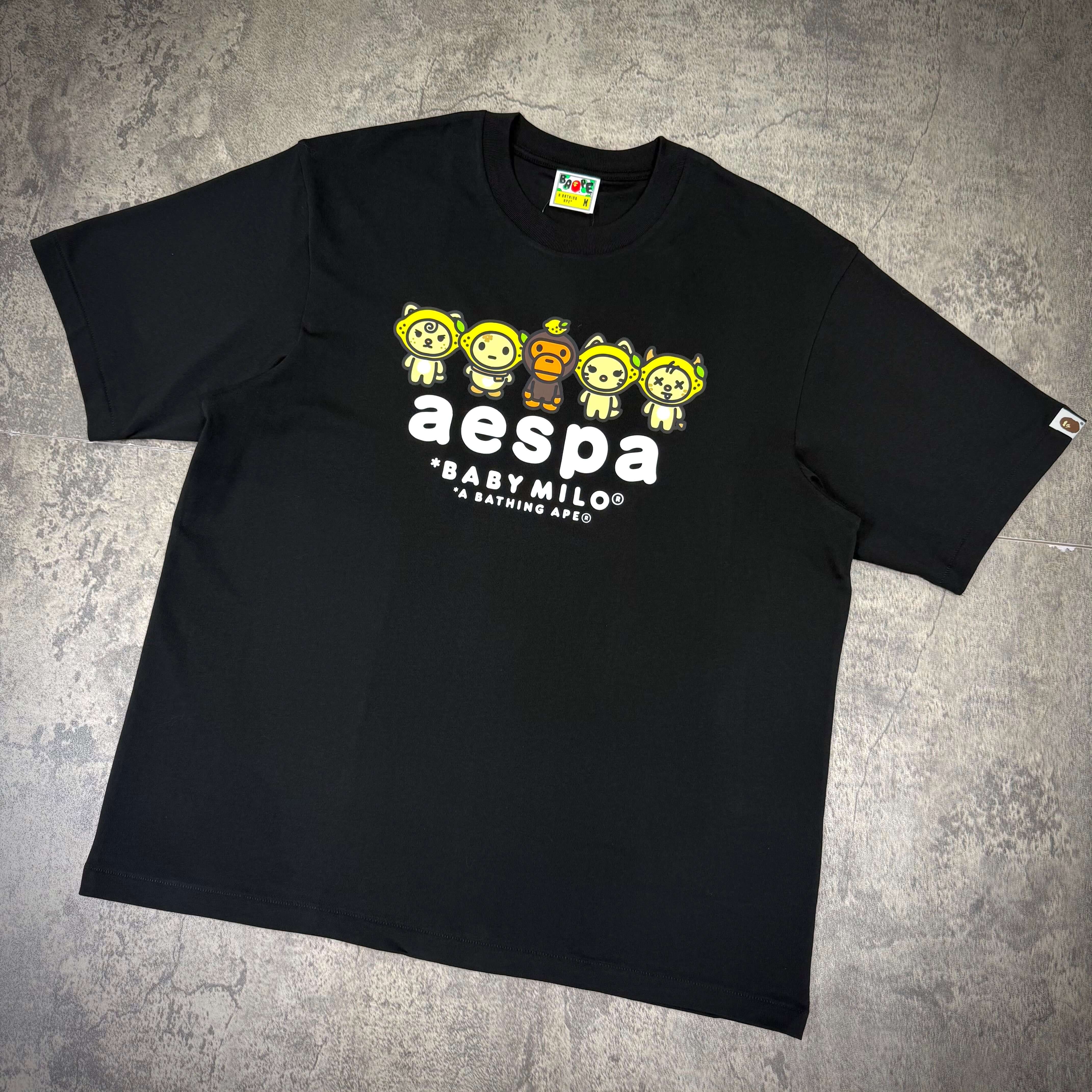 aespa x BAPE Baby Milo Lemonade Relaxed Fit Tee in black with playful graphic design.