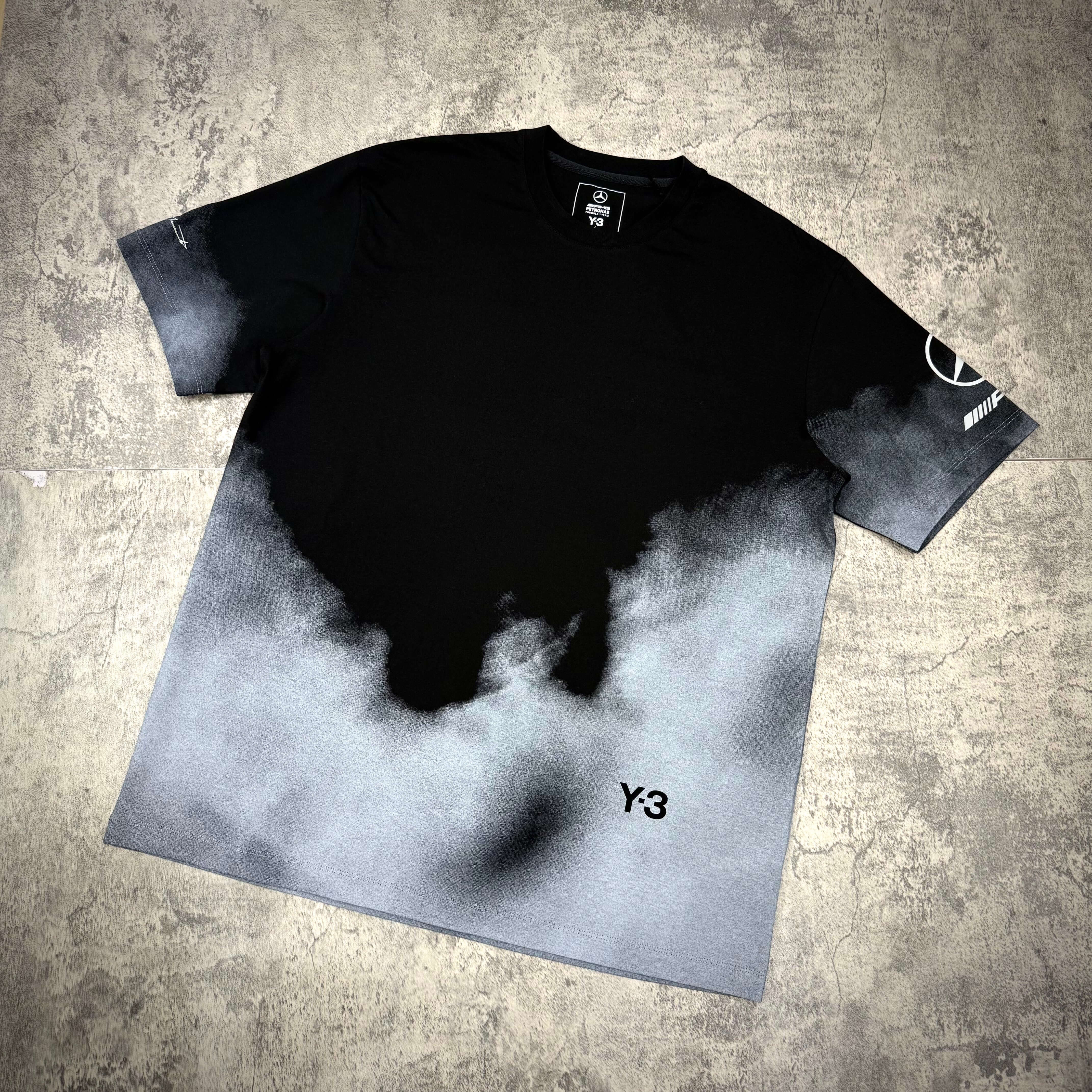 Y-3 x Mercedes AMG Petronas F1 Tour Tee featuring a black and gray gradient design with Y-3 branding.