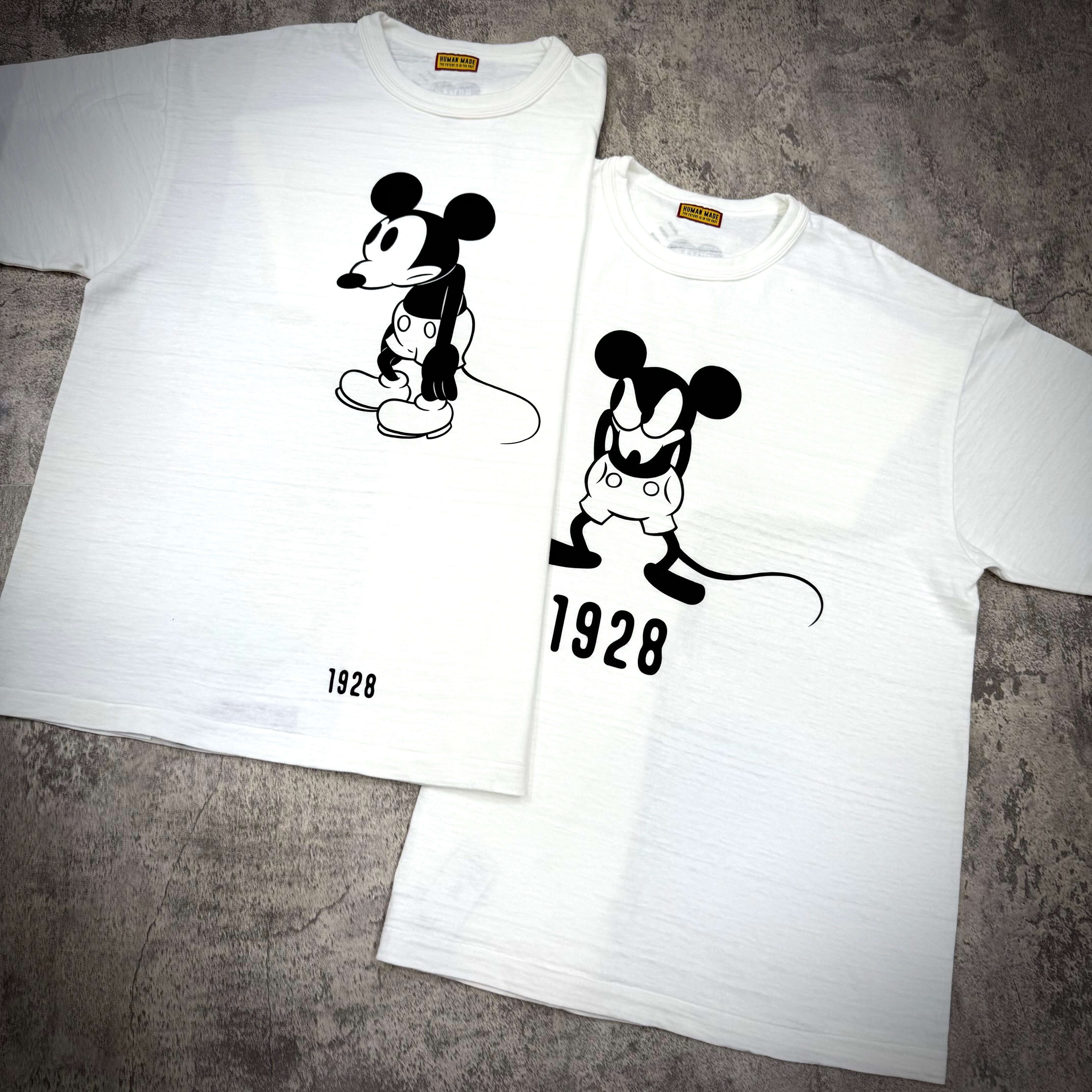 Human Made 1928 Disney Mickey Graphic Tee featuring classic Mickey Mouse designs in black on white shirts.
