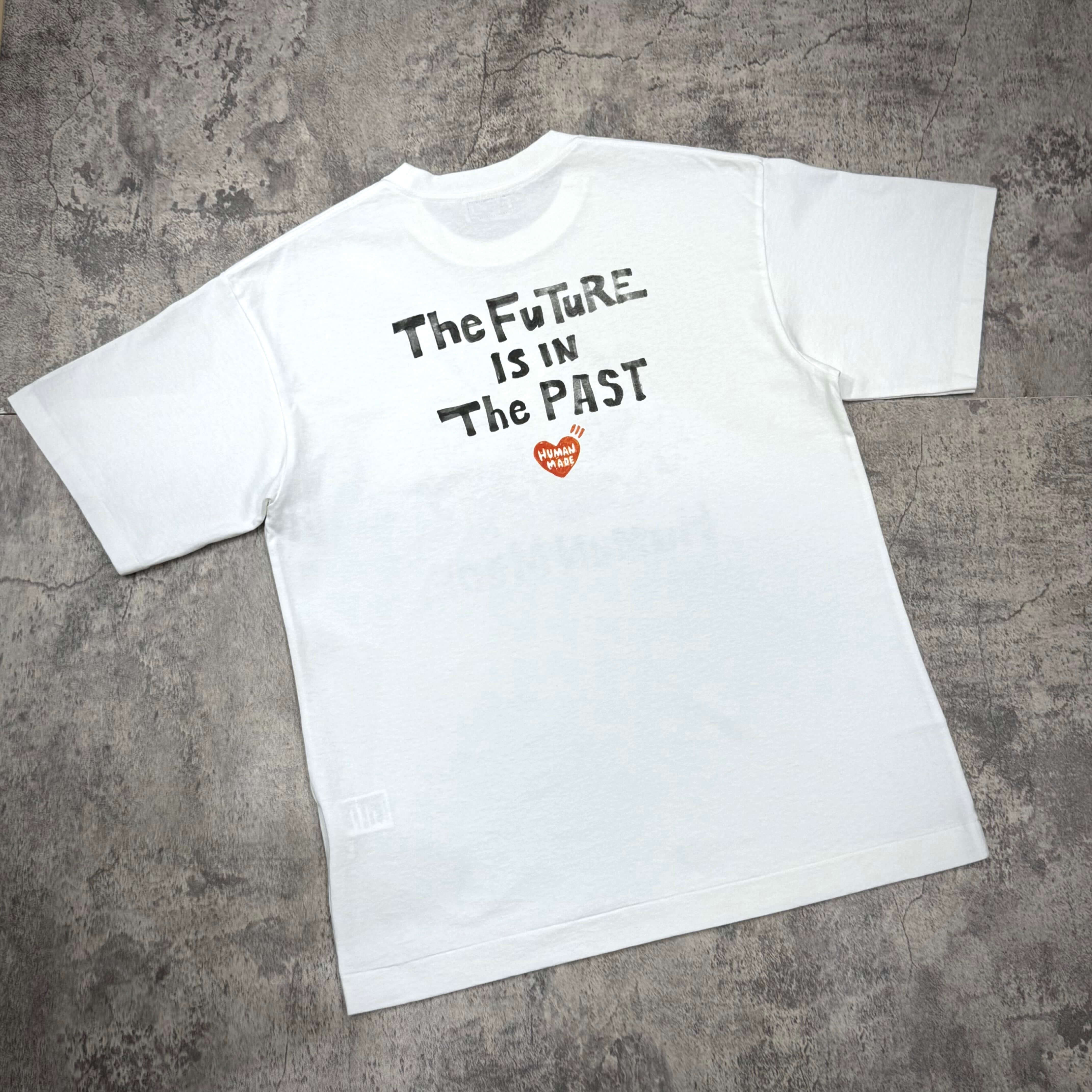 Human Made Graphic Tee HM31CS009 featuring the text 'The Future is IN The PAST' on a white t-shirt.