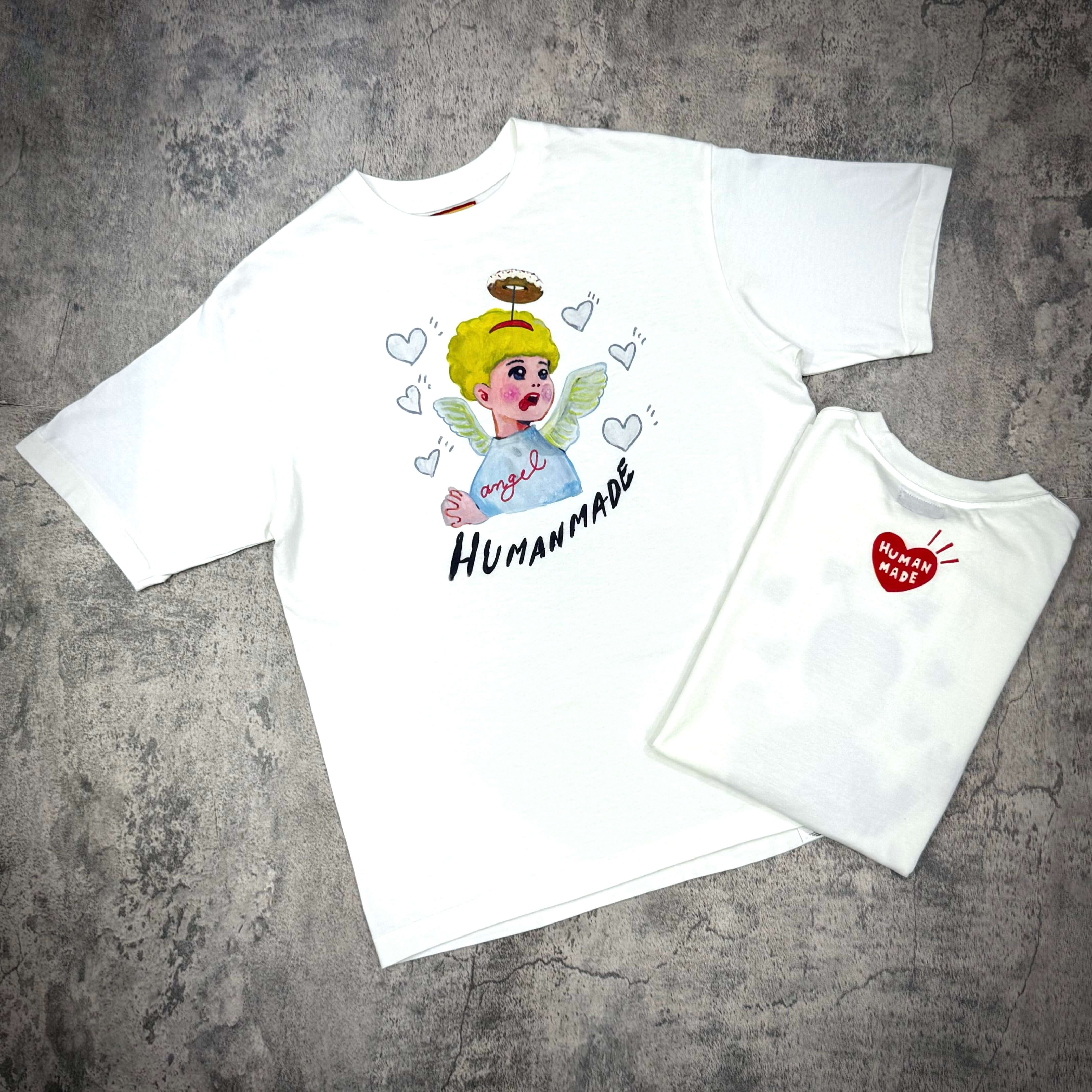 Human Made Keiko Sootome "Angel vs Demon" Tee featuring angel graphic on white shirt.