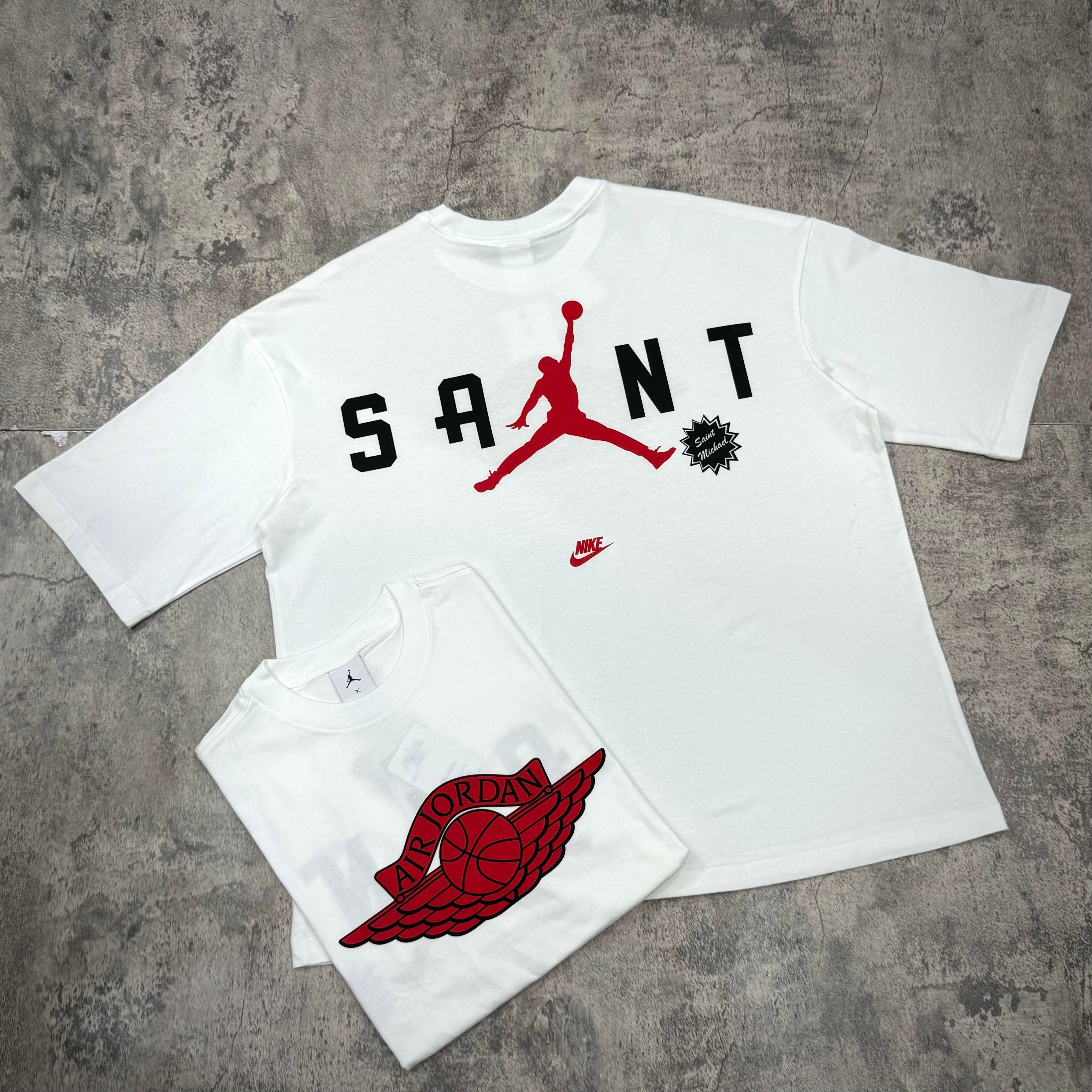 Saint Mxxxxxx Michael Jordan TIME CAPSULE Tee displayed with iconic Winged Logo design in white and red color scheme.
