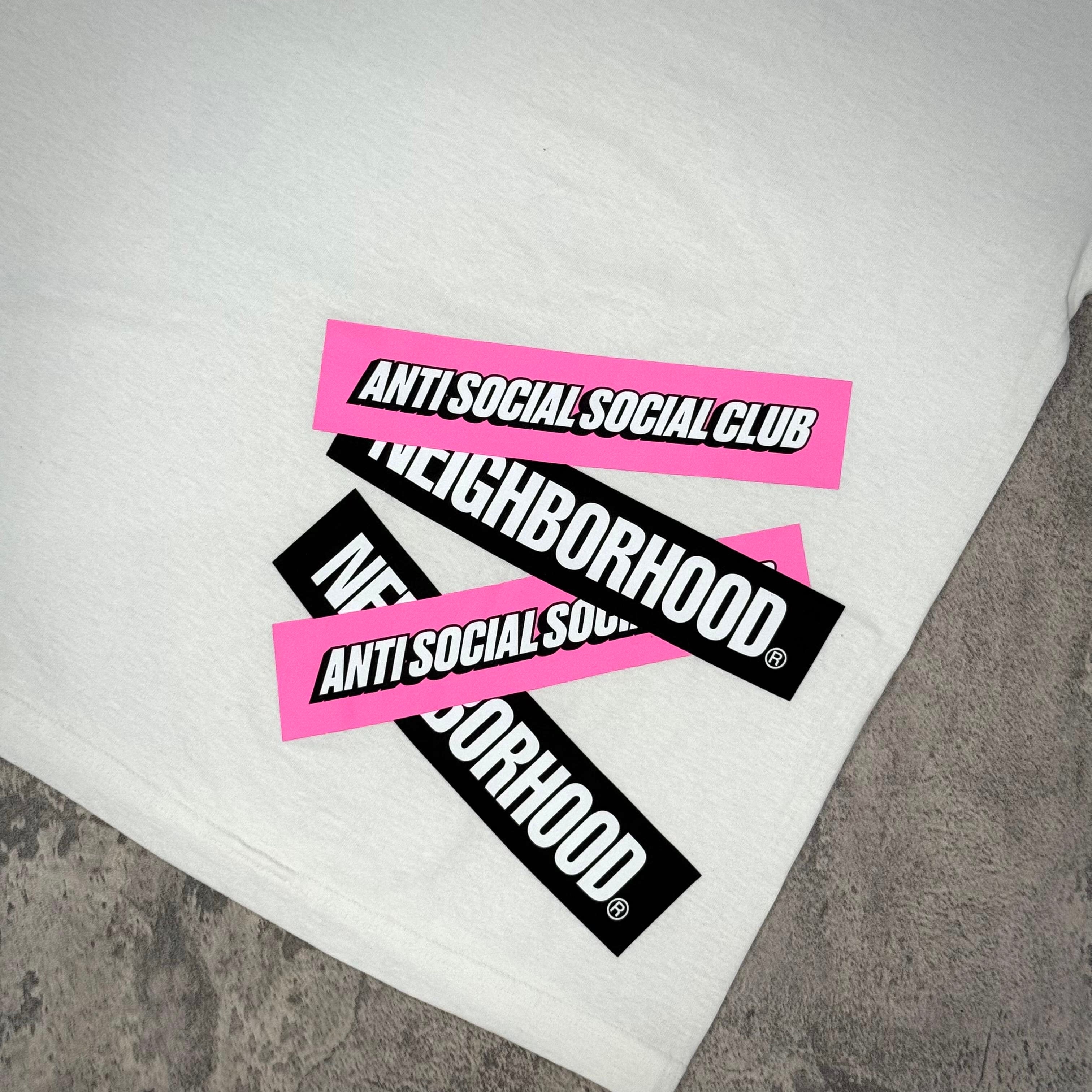 ASSC x Neighborhood Stuck On You Tee - Black / White featuring pink and black stickers on a white shirt.