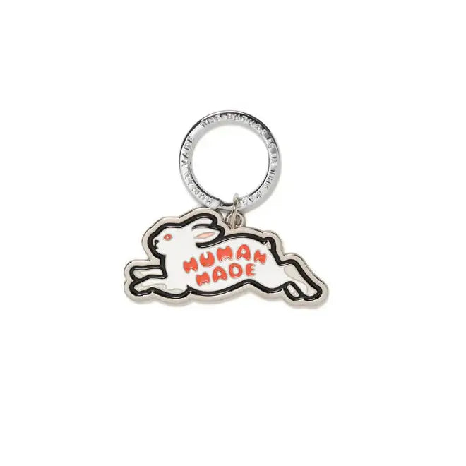 Human Made Animal Keyring featuring a playful rabbit design in white and orange.