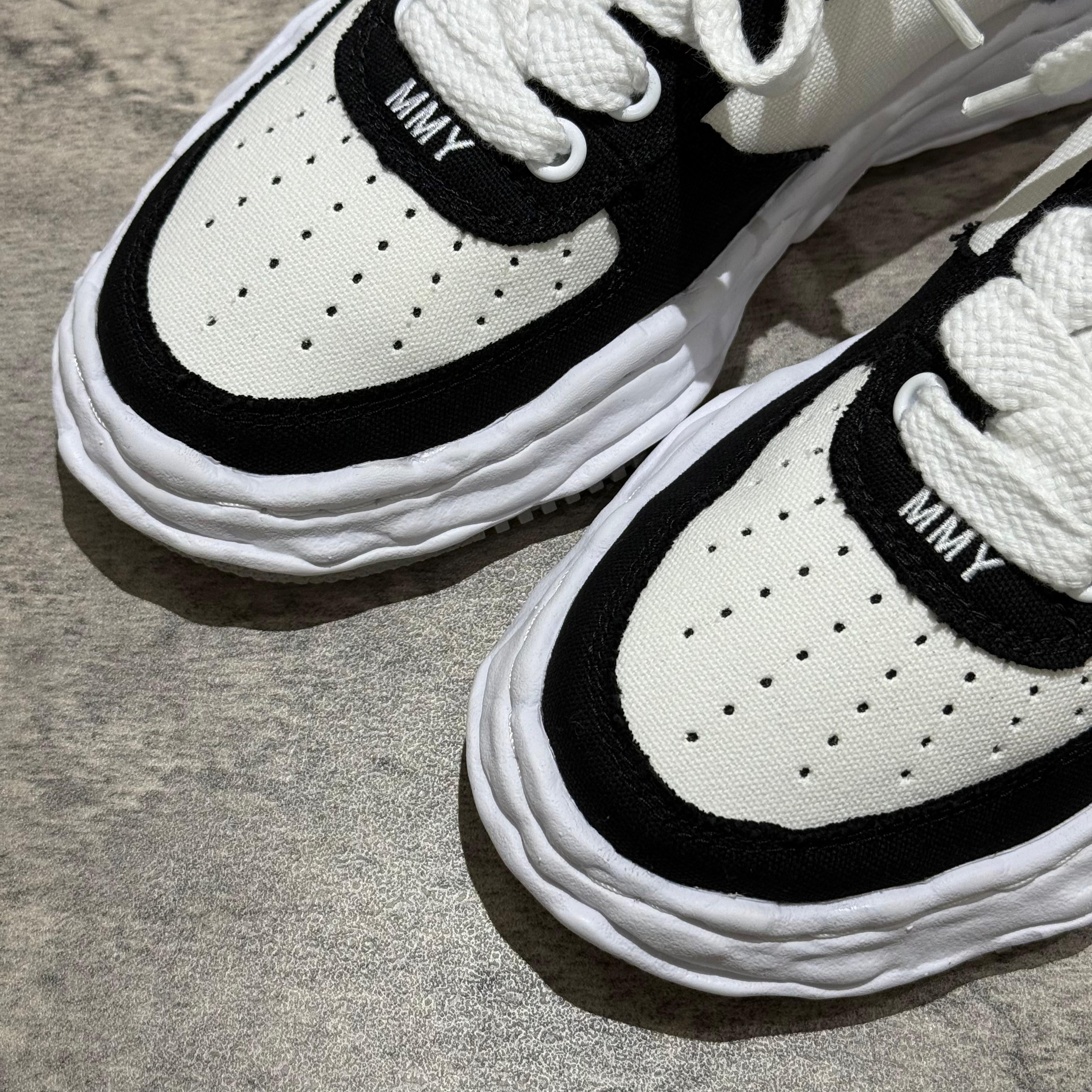 MMY WAYNE OG Canvas sneakers in black and white, featuring perforated design and MMY logo on tongue.