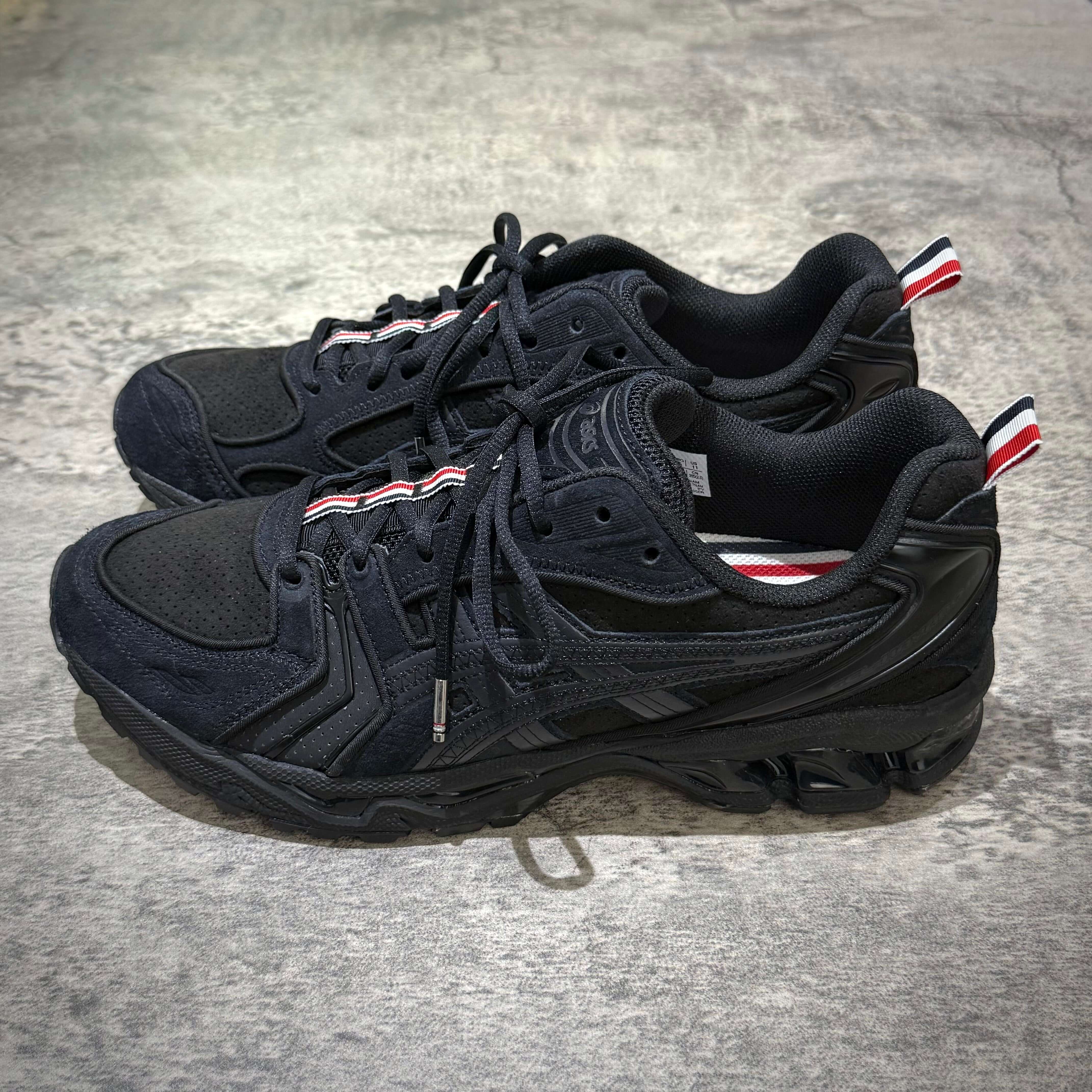 Thom Browne x Asics Gel-Kayano 14 in Black, stylish athletic shoes featuring signature branding and premium materials.
