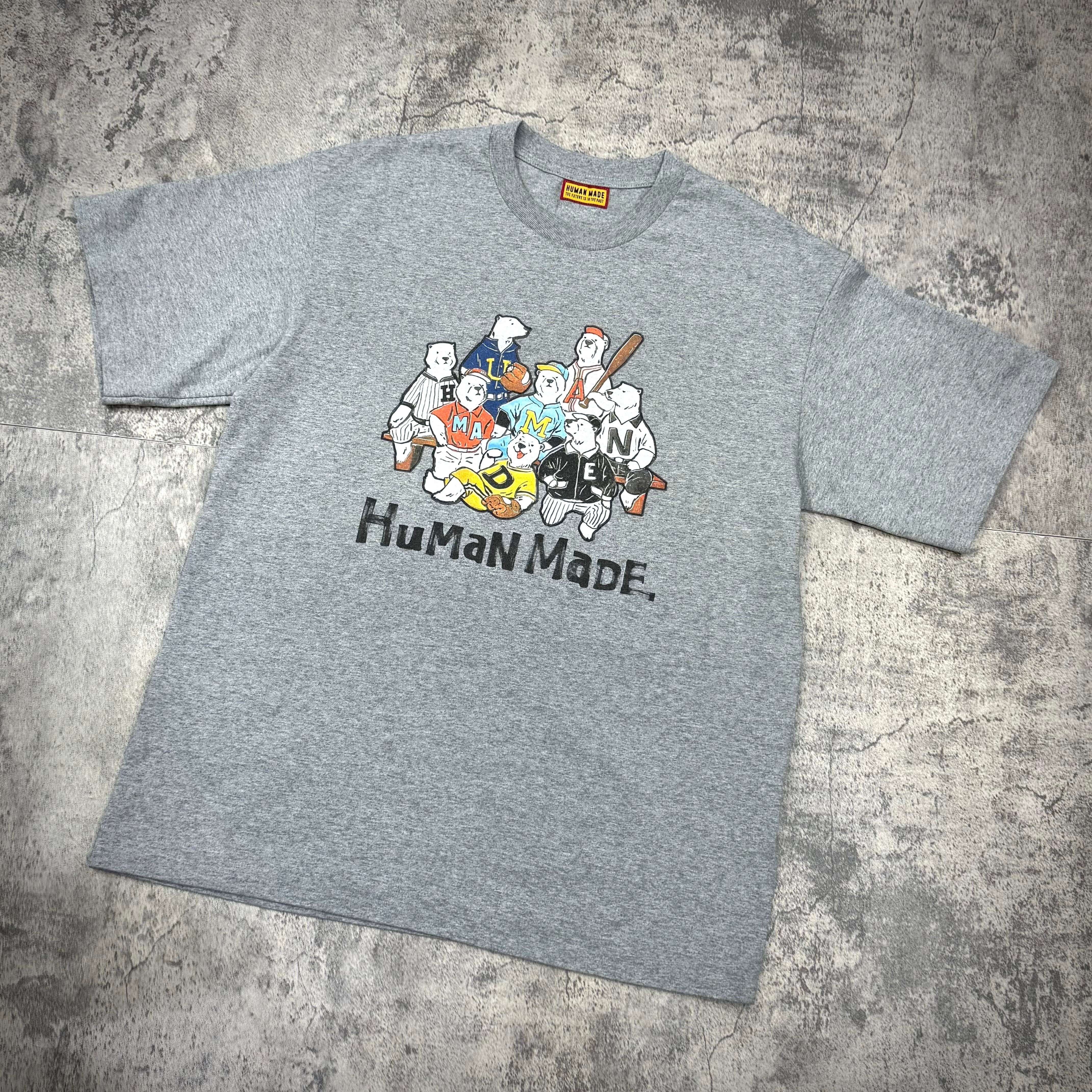 Human Made Graphic Tee HM31CS009 featuring a colorful graphic design on a gray t-shirt.