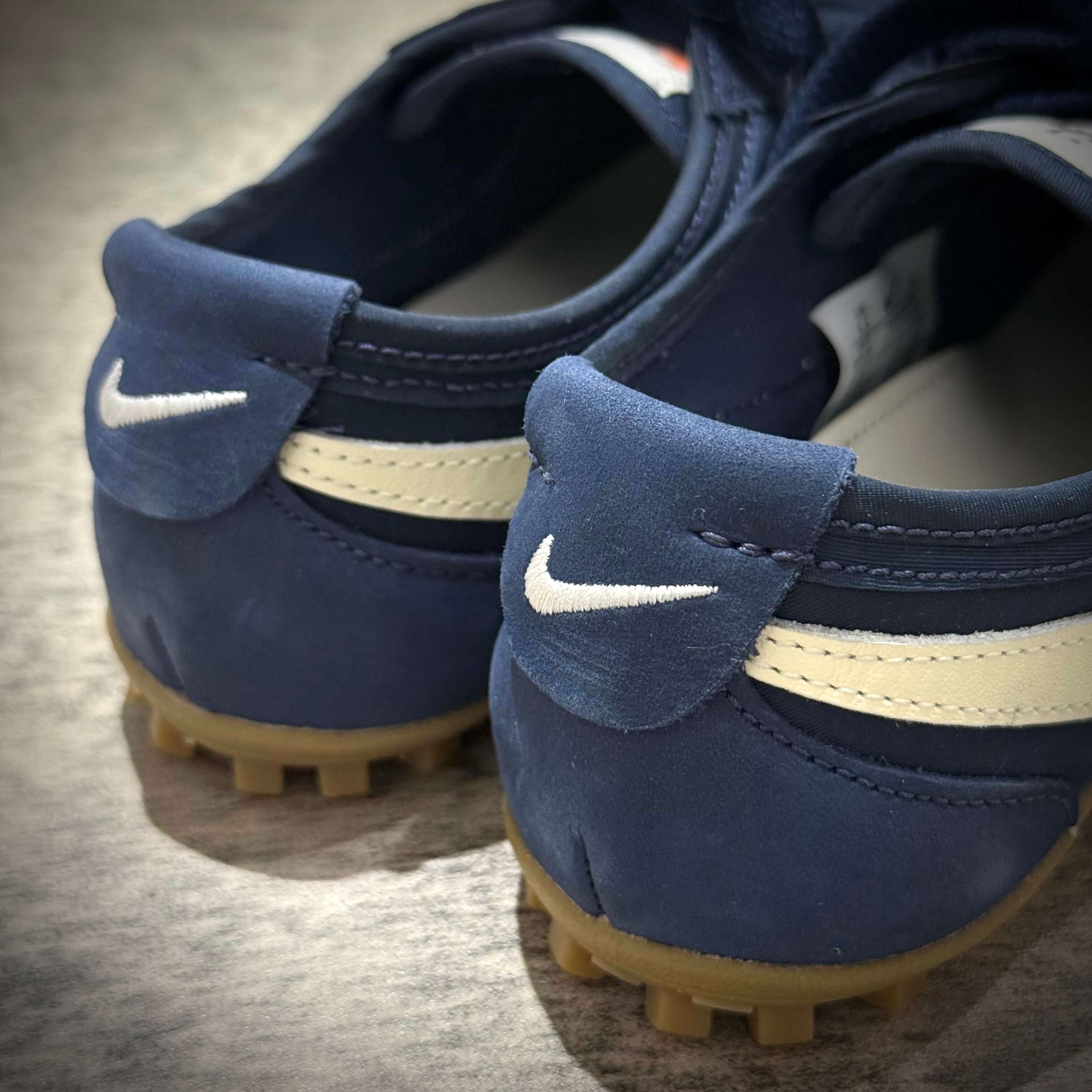 Close-up of the Nike Moon Shoe OG in Midnight Navy showing back details and iconic Nike logo.