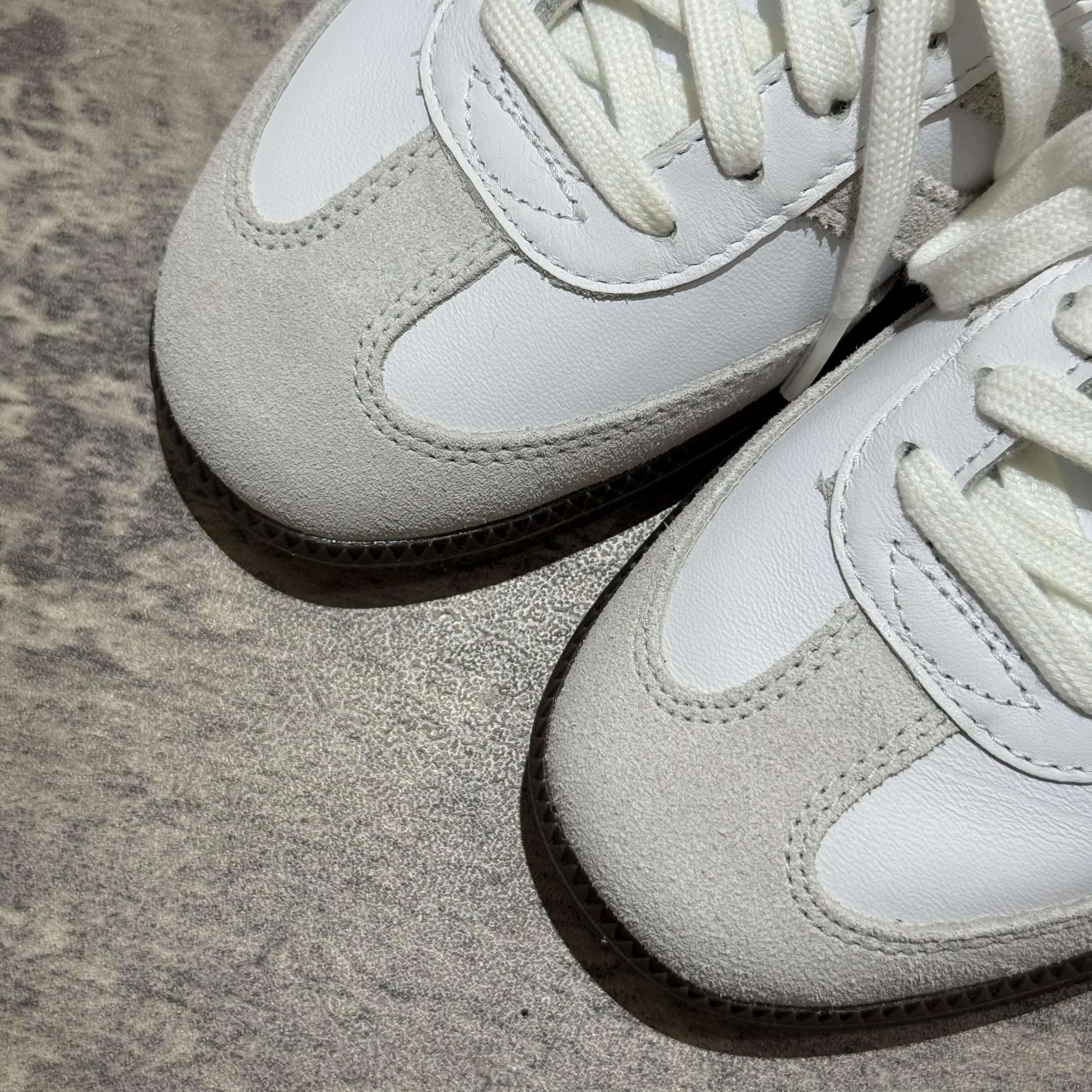 Kith Classic x Adidas Original Samba OG shoes in white and green with suede and leather details.