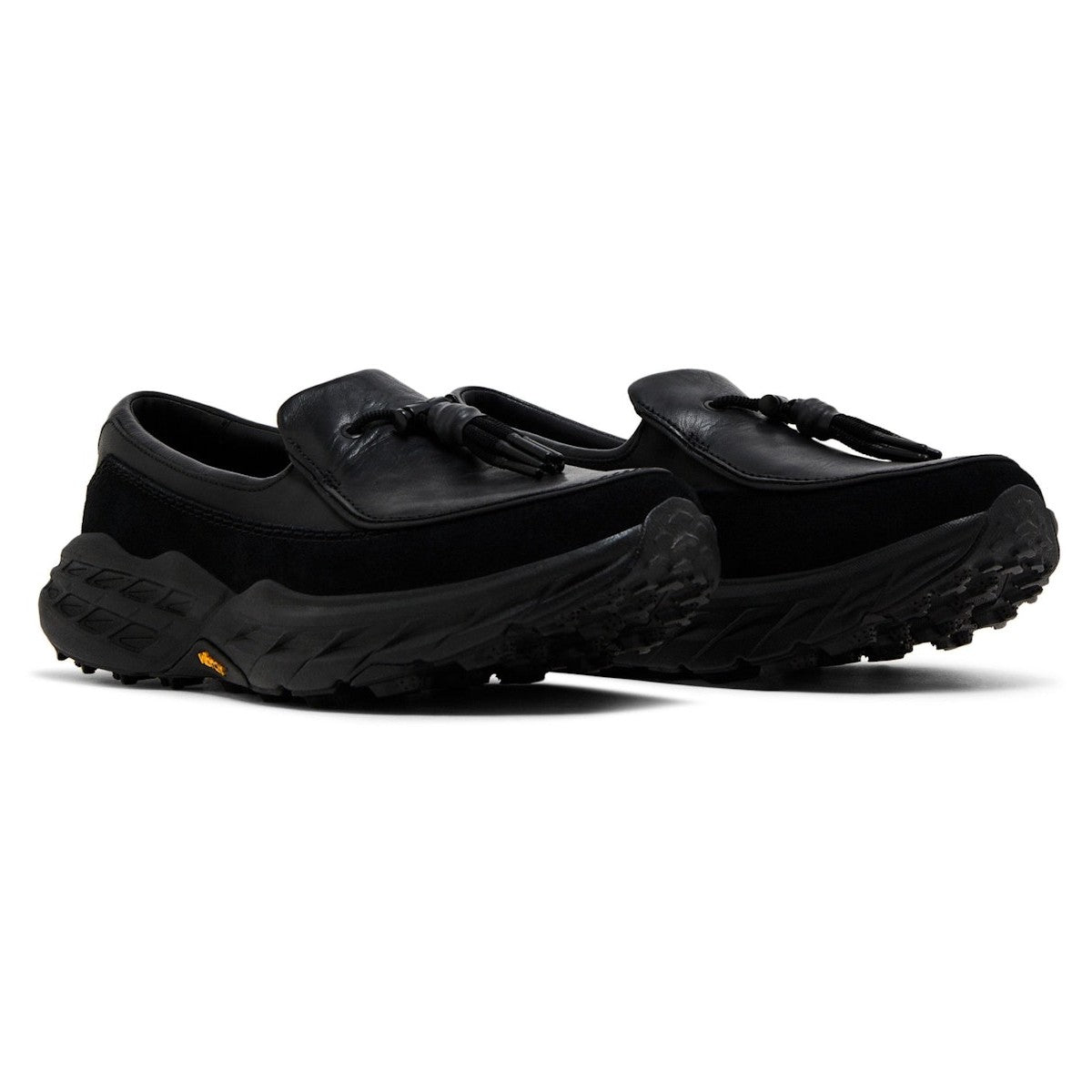 Hoka Speed Loafers - Black 1162170-BBLC displayed from the side, featuring a sleek black design and trail-engineered outsole.