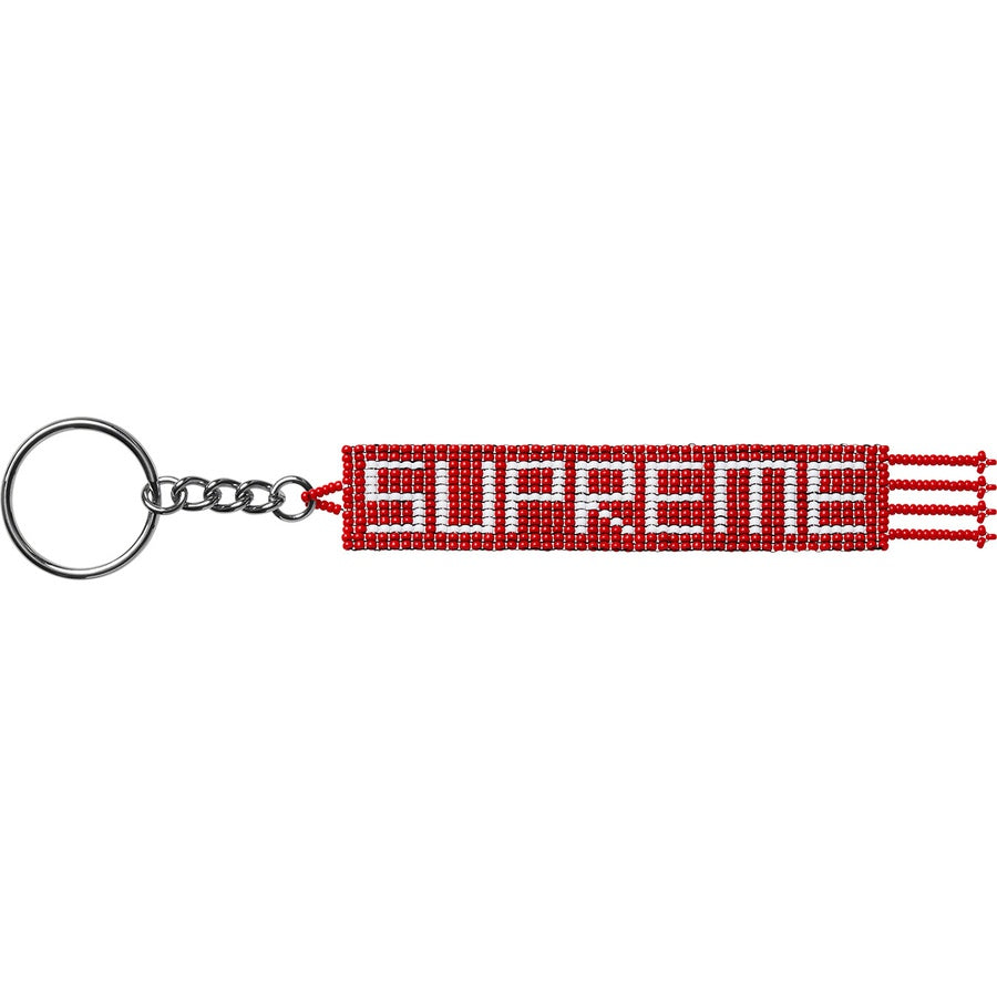 Supreme Beaded Keychain featuring vibrant red beads and keyring attachment, unique fashion accessory.